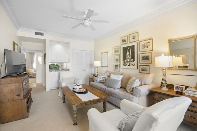 living room featuring crown molding, light colored carpet, and ceiling fan