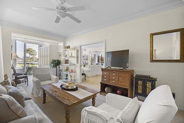 living room featuring crown molding and ceiling fan