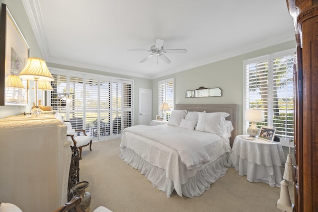 bedroom with crown molding, carpet floors, and ceiling fan