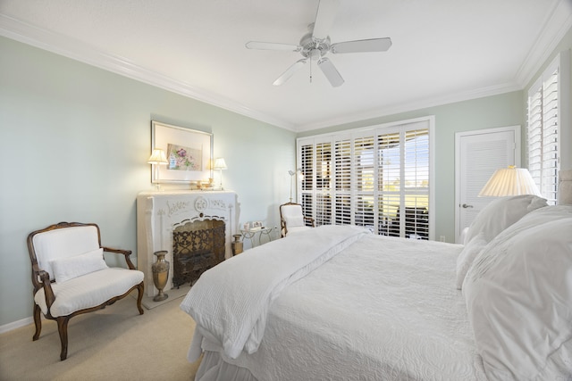 bedroom featuring ornamental molding, ceiling fan, and carpet