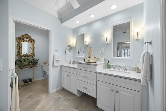 bathroom with vanity, ceiling fan, ornamental molding, and toilet