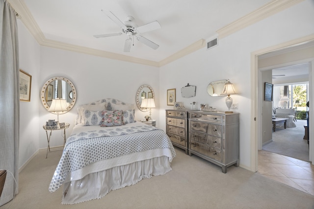 carpeted bedroom with crown molding and ceiling fan