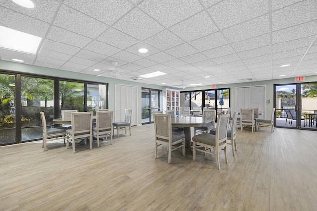 dining area with hardwood / wood-style flooring and plenty of natural light