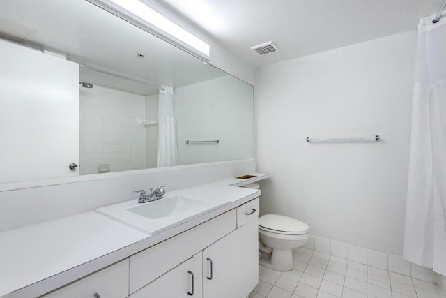 bathroom with tile patterned flooring, vanity, a shower with shower curtain, and toilet