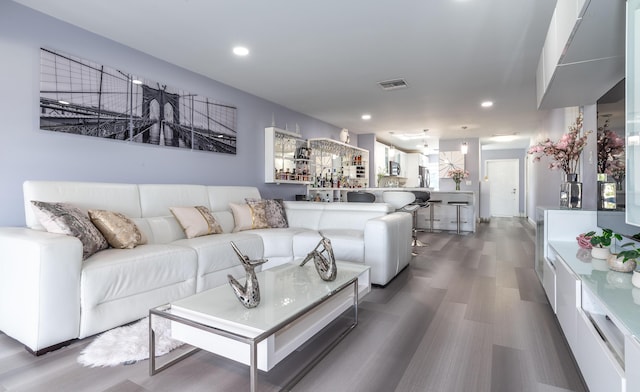 living room with dark hardwood / wood-style floors