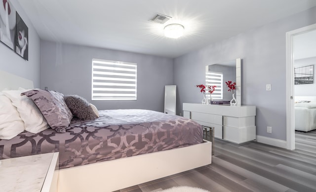 bedroom featuring dark wood-type flooring