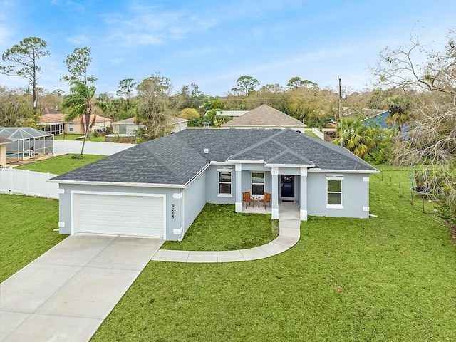 single story home with a garage and a front yard