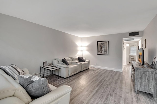 living room featuring light wood-type flooring