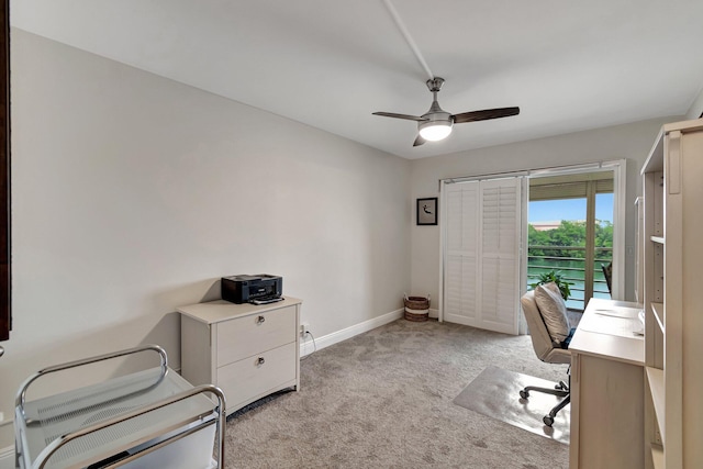 carpeted office with ceiling fan