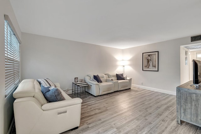 living room with light hardwood / wood-style floors