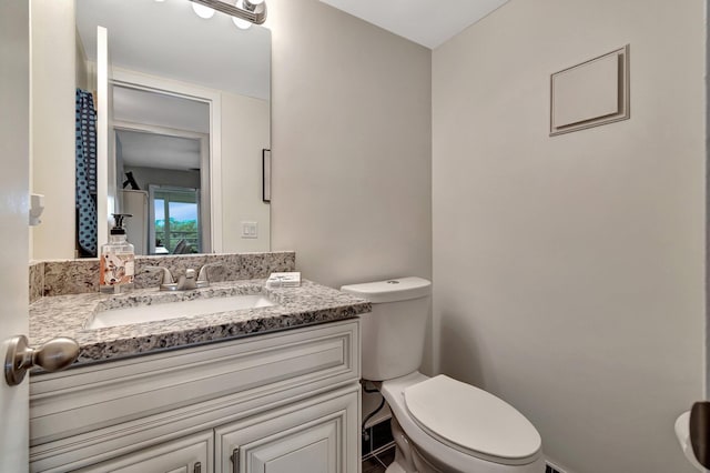 bathroom with vanity and toilet