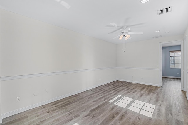 empty room featuring light hardwood / wood-style flooring and ceiling fan