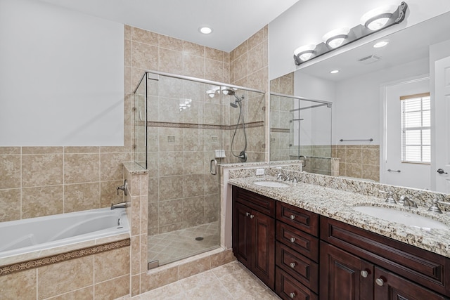 bathroom featuring vanity, tile patterned floors, and independent shower and bath