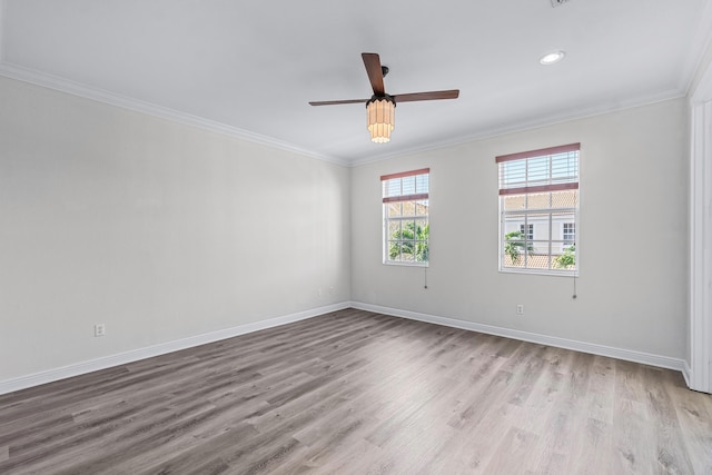 spare room featuring ornamental molding, ceiling fan, and light hardwood / wood-style floors