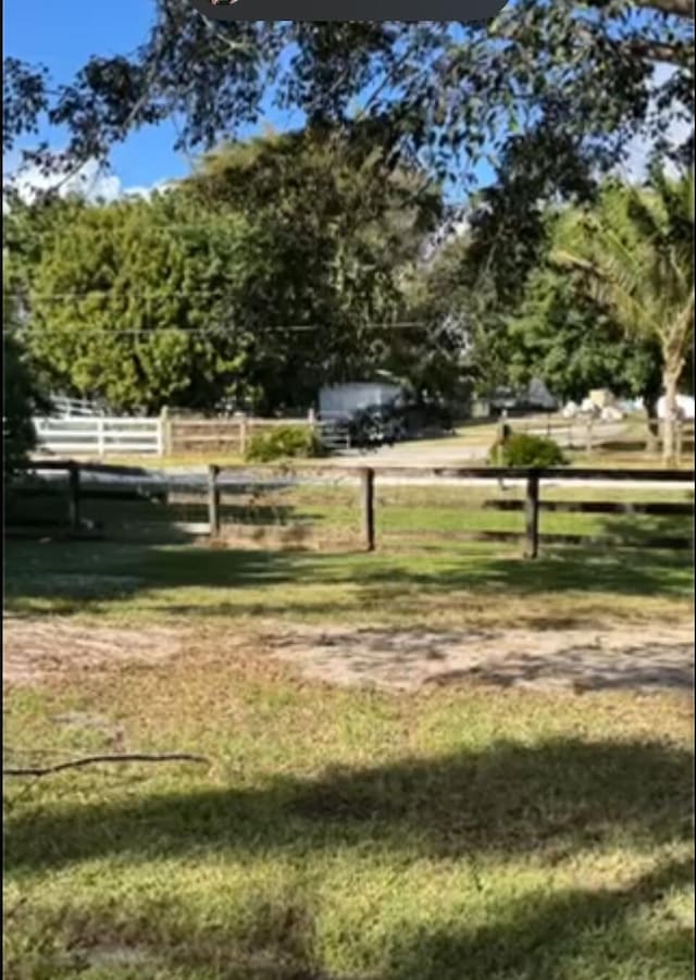 view of home's community featuring a lawn