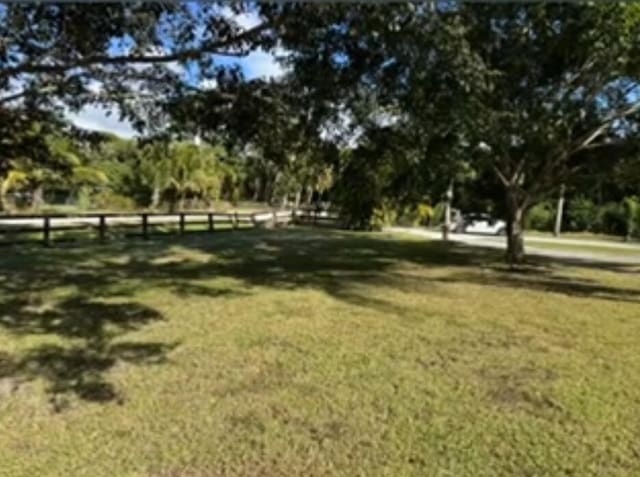 view of home's community with a lawn