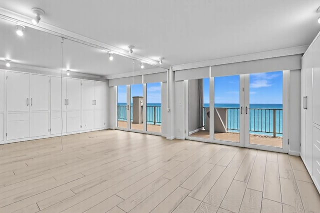 3000 S Ocean Blvd Unit 1504, Boca Raton, FL 33432 - unfurnished room with light wood-type flooring, expansive windows, and a water view
