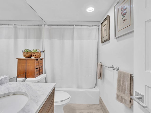 full bathroom featuring shower / bathtub combination with curtain, vanity, and toilet