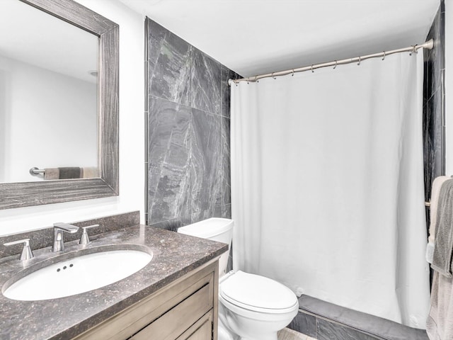 3000 S Ocean Blvd Unit 1504, Boca Raton, FL 33432 - bathroom featuring toilet, vanity, tile walls, and curtained shower
