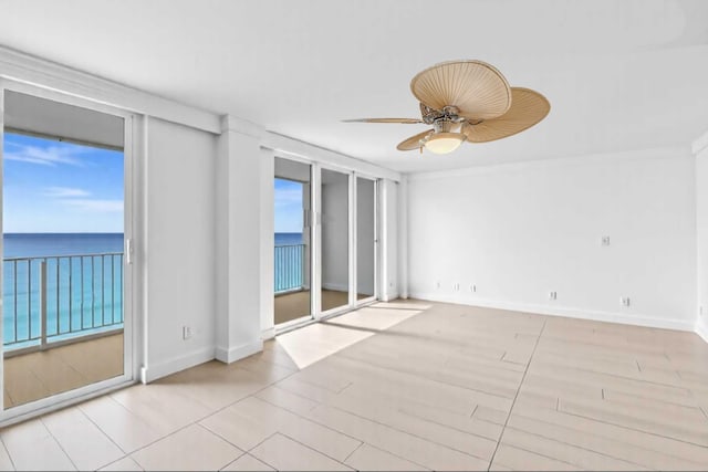3000 S Ocean Blvd Unit 1504, Boca Raton, FL 33432 - empty room featuring ceiling fan, a water view, and baseboards