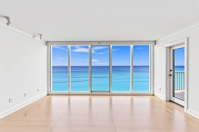 3000 S Ocean Blvd Unit 1504, Boca Raton, FL 33432 - unfurnished room with ornamental molding, baseboards, a water view, and tile patterned floors