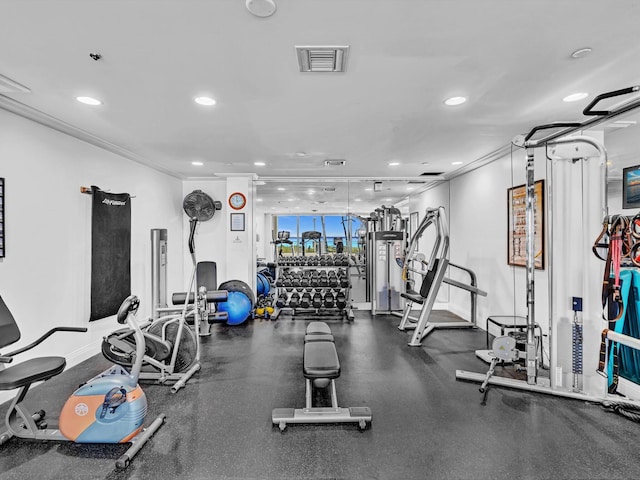 exercise room with ornamental molding