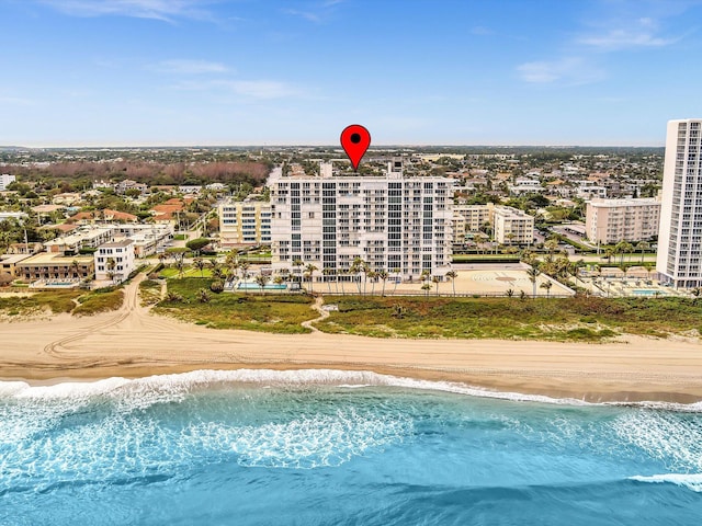 bird's eye view with a view of the beach and a water view