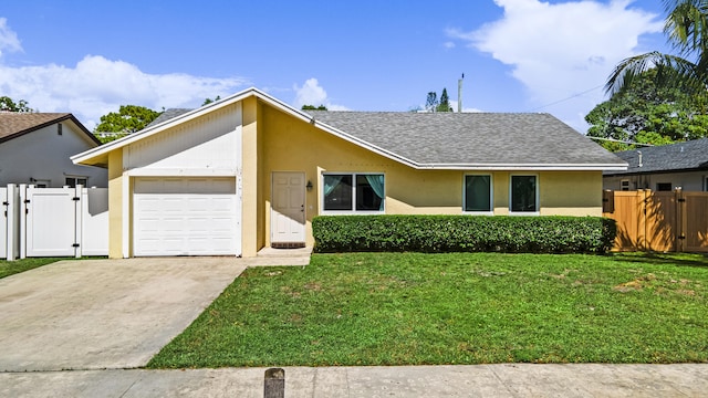 ranch-style home with a garage and a front yard