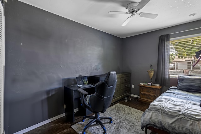 bedroom featuring ceiling fan and dark hardwood / wood-style floors