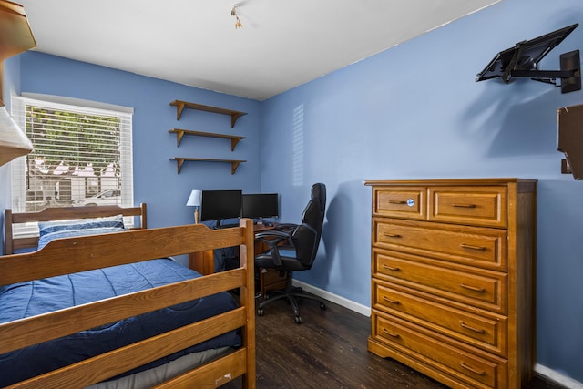 bedroom featuring dark hardwood / wood-style flooring