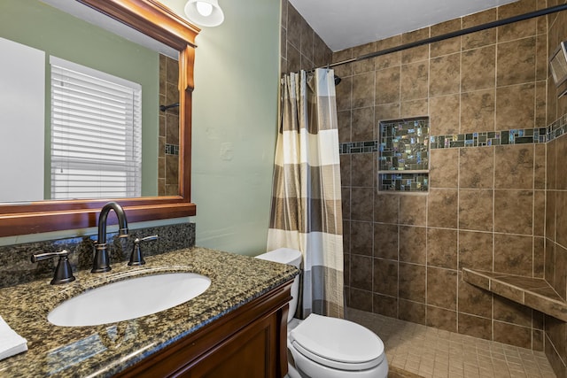 bathroom with vanity, toilet, and a shower with curtain