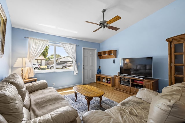 living room with vaulted ceiling, ceiling fan, and light hardwood / wood-style floors