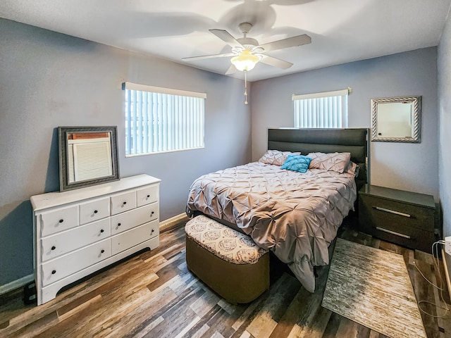 bedroom with ceiling fan and wood-type flooring