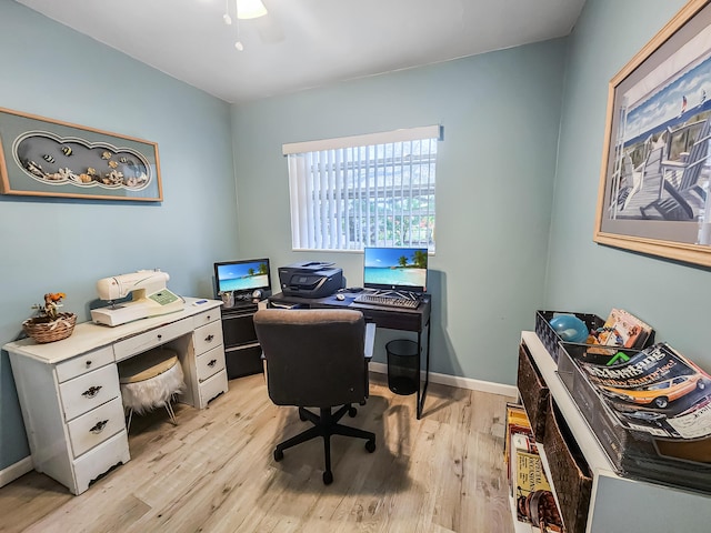 home office with ceiling fan and light hardwood / wood-style flooring