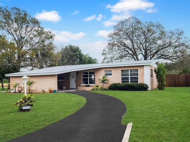 single story home with a front yard