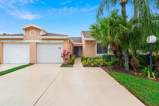 single story home with a garage