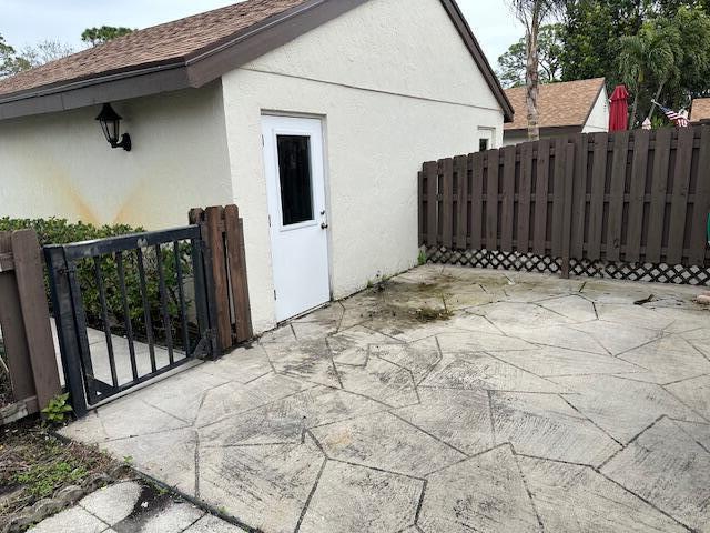 view of side of home featuring a patio area