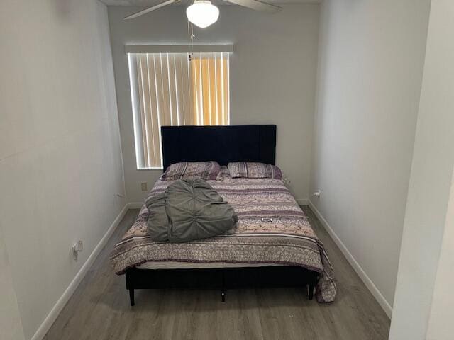 bedroom featuring hardwood / wood-style floors and ceiling fan