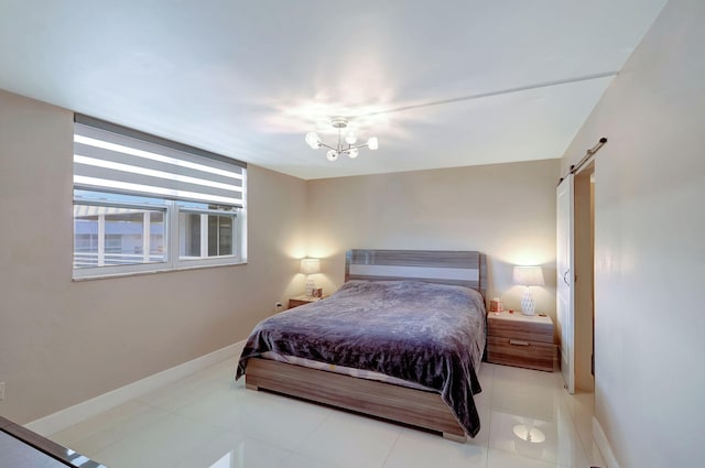 3600 NE 170th St Unit 407, North Miami Beach, FL 33160 - bedroom with baseboards, light tile patterned floors, and a barn door