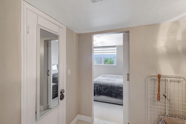 hallway featuring light tile patterned flooring