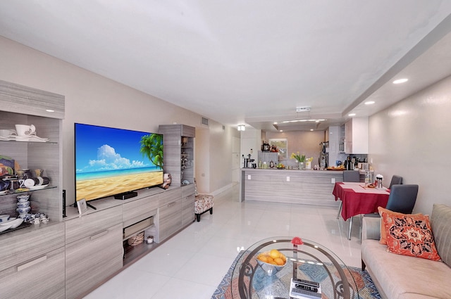 living room with light tile patterned flooring