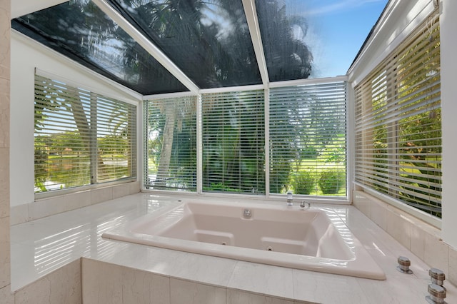 bathroom featuring a relaxing tiled tub