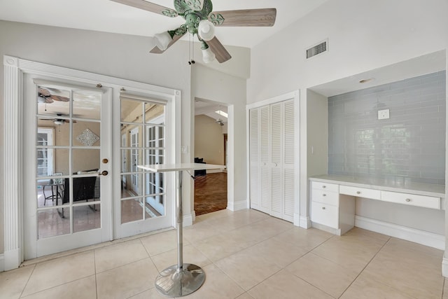 bathroom with ceiling fan, french doors, tile patterned flooring, and lofted ceiling