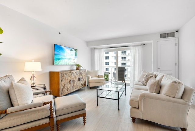 living room with light hardwood / wood-style flooring