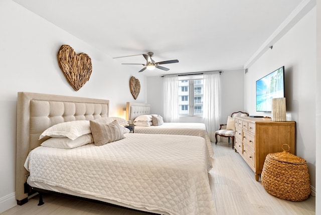 bedroom featuring ceiling fan and light hardwood / wood-style flooring