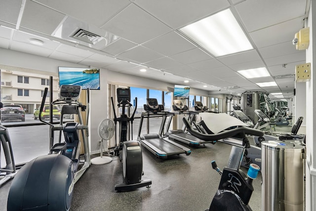 gym featuring a paneled ceiling