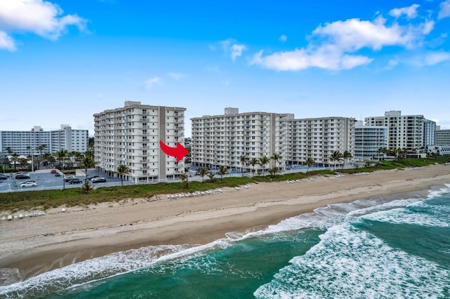 aerial view with a view of the beach and a water view