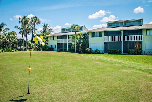 view of home's community with a lawn