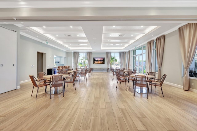 dining room featuring light wood-type flooring, a tray ceiling, baseboards, and recessed lighting