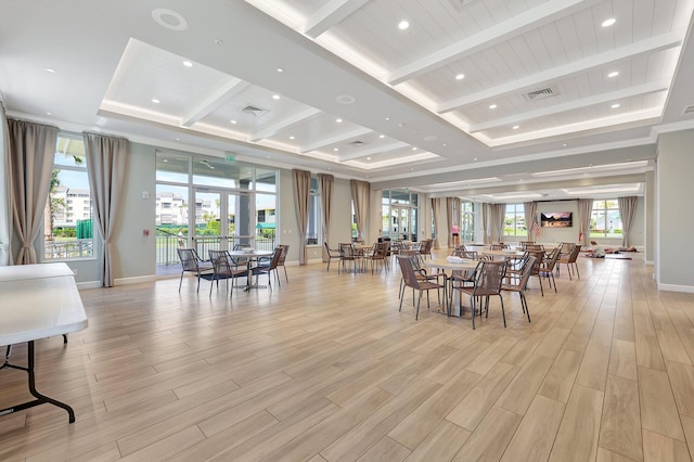 dining area with baseboards, visible vents, beamed ceiling, a tray ceiling, and light wood-style floors